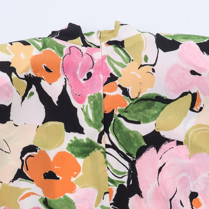 Damblus med blommönster och elegant knut Mirla-Eva Jonsson