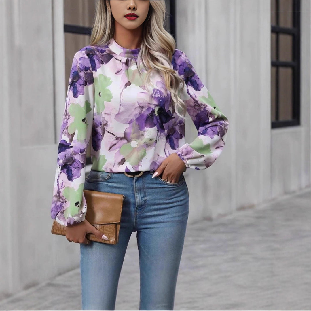 Damblus med blommönster och eleganta puffärmar Mirla-Eva Jonsson