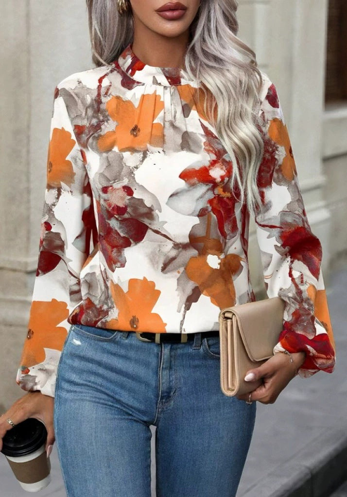 Damblus med blommönster och eleganta puffärmar Mirla-Eva Jonsson