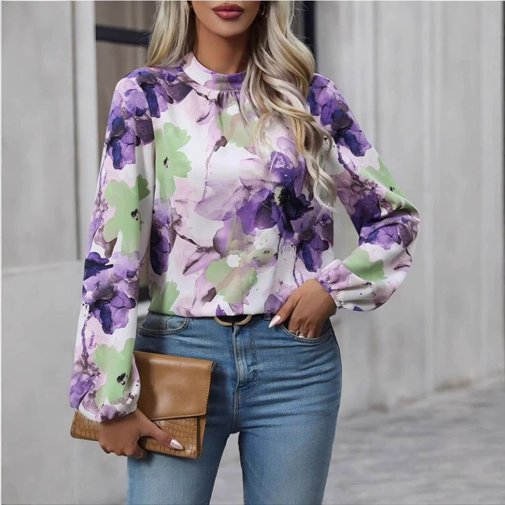 Damblus med blommönster och eleganta puffärmar Mirla-Eva Jonsson