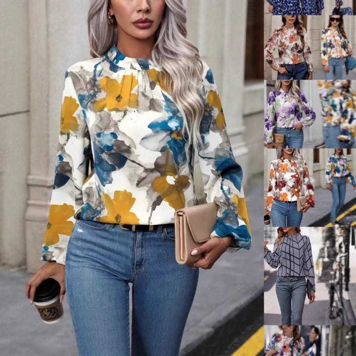 Damblus med blommönster och eleganta puffärmar Mirla-Eva Jonsson