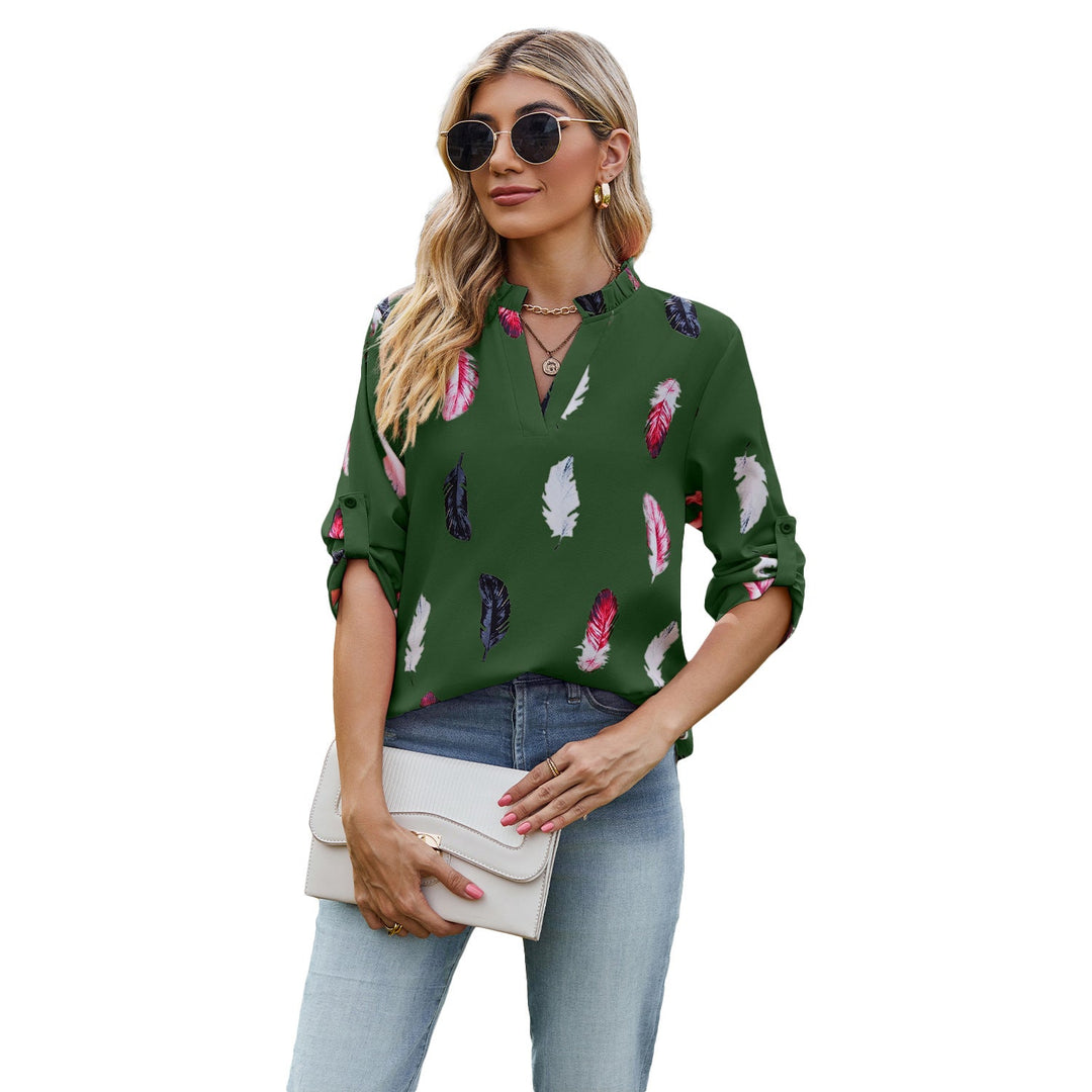 Damblus med eleganta fjädermönster och halvlånga ärmar Mirla-Eva Jonsson