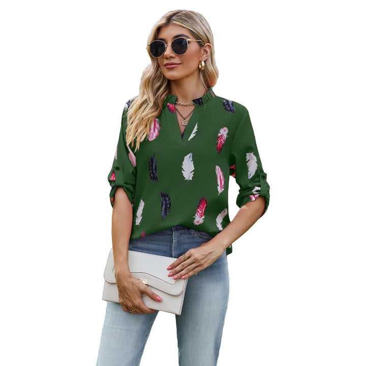 Damblus med eleganta fjädermönster och halvlånga ärmar Mirla-Eva Jonsson