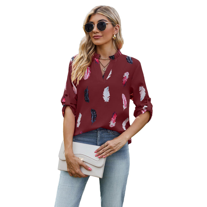 Damblus med eleganta fjädermönster och halvlånga ärmar Mirla-Eva Jonsson