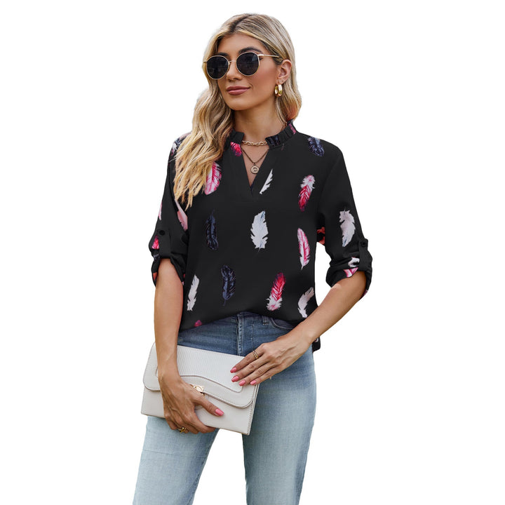 Damblus med eleganta fjädermönster och halvlånga ärmar Mirla-Eva Jonsson