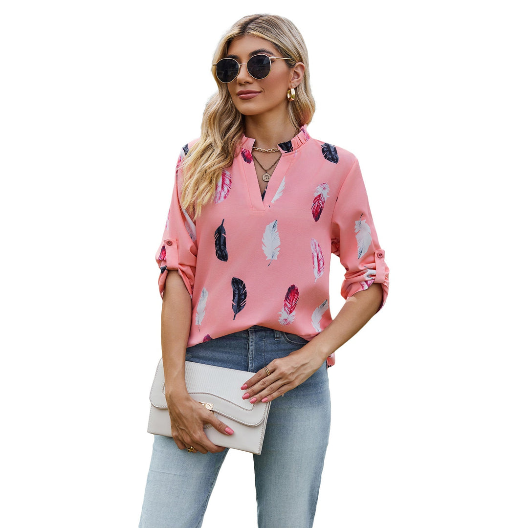 Damblus med eleganta fjädermönster och halvlånga ärmar Mirla-Eva Jonsson
