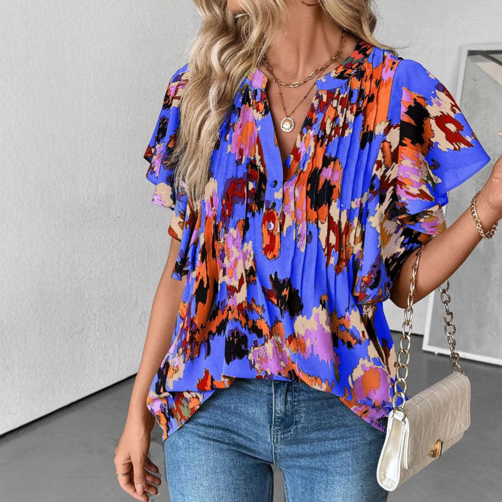 Damblus med eleganta volangdetaljer och lekfullt tryck Mirla-Eva Jonsson