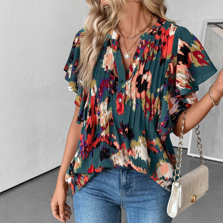 Damblus med eleganta volangdetaljer och lekfullt tryck Mirla-Eva Jonsson