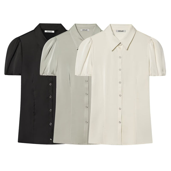 Damblus med korta puffärmar och elegant knapprad Mirla-Eva Jonsson