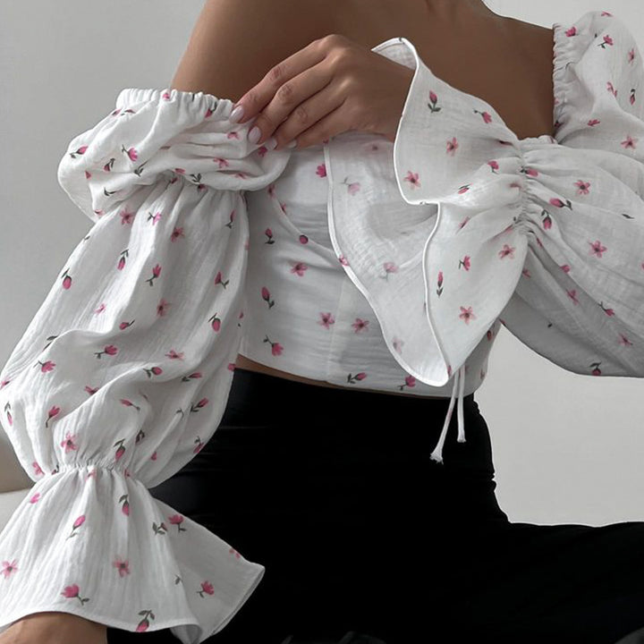 Damblus med puffärmar och blommönster Mirla-Eva Jonsson
