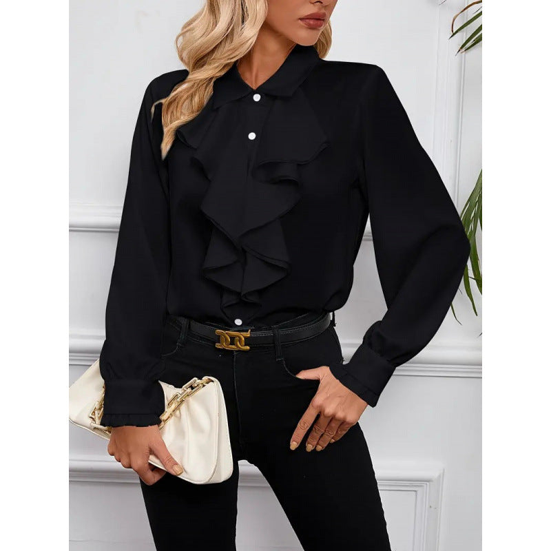 Damblus med raffinerade ruffledetaljer och eleganta ärmar Mirla-Eva Jonsson