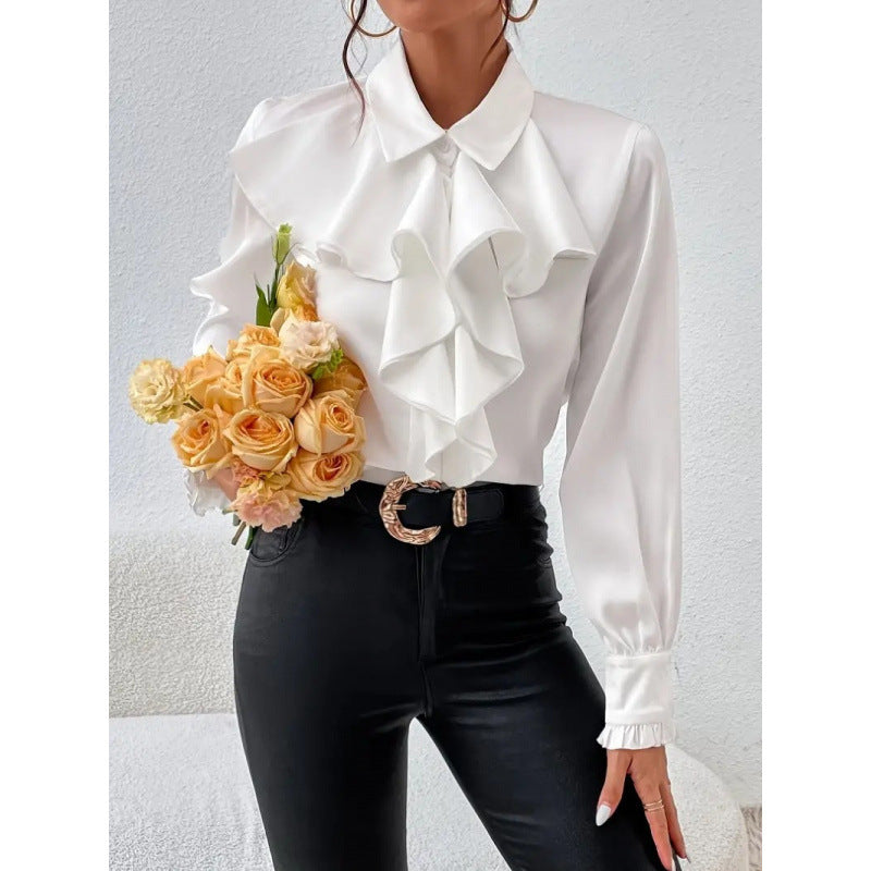 Damblus med raffinerade ruffledetaljer och eleganta ärmar Mirla-Eva Jonsson
