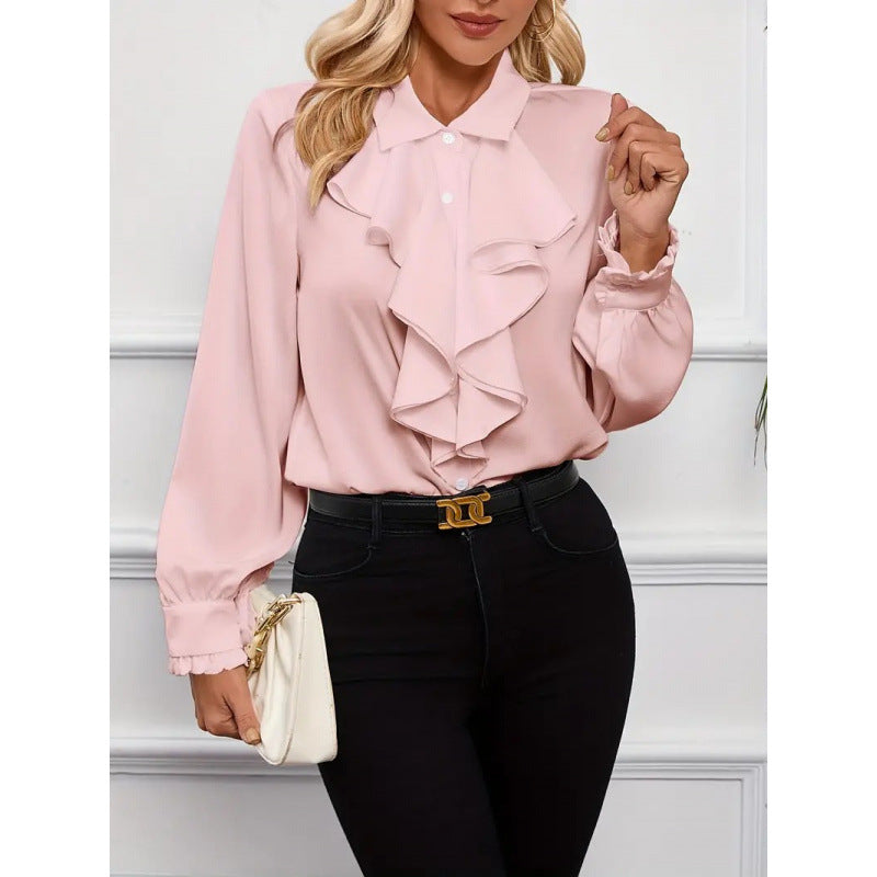 Damblus med raffinerade ruffledetaljer och eleganta ärmar Mirla-Eva Jonsson