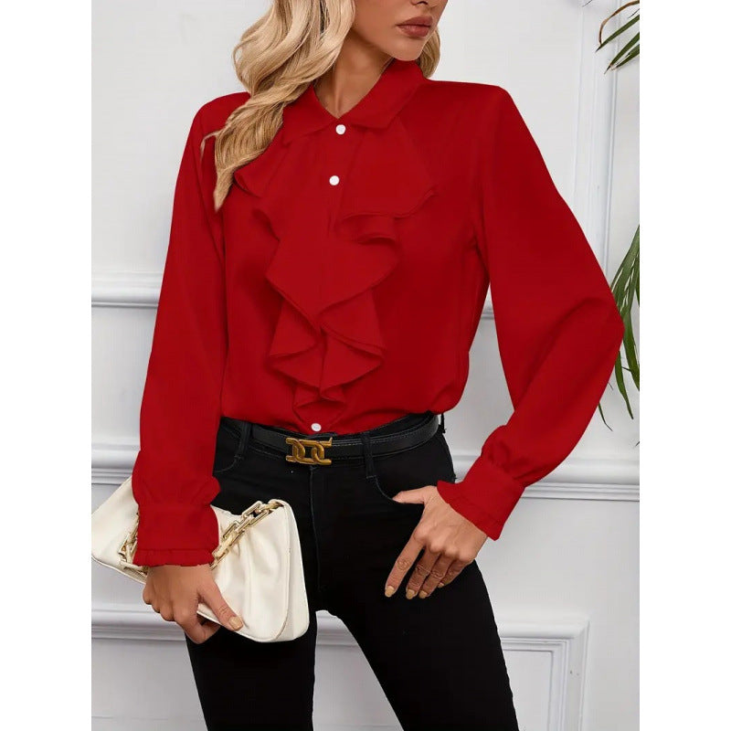 Damblus med raffinerade ruffledetaljer och eleganta ärmar Mirla-Eva Jonsson