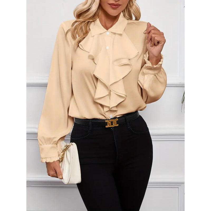 Damblus med raffinerade ruffledetaljer och eleganta ärmar Mirla-Eva Jonsson
