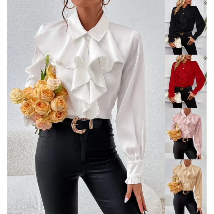 Damblus med raffinerade ruffledetaljer och eleganta ärmar Mirla-Eva Jonsson