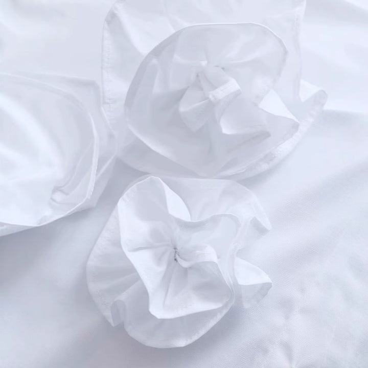 Damblus med strukturerade volanger Mirla-Eva Jonsson