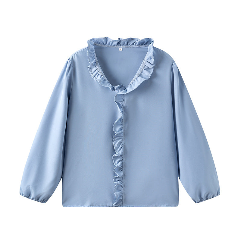 Damblus med volangdetaljer och elegant ståkrage Mirla-Eva Jonsson