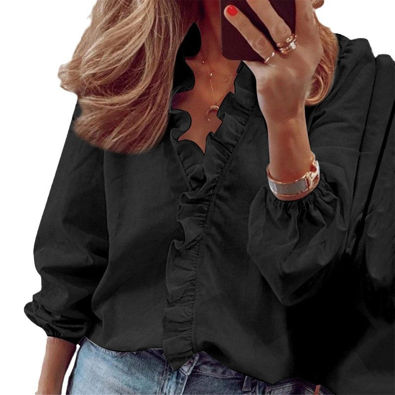 Damblus med volangdetaljer och elegant ståkrage Mirla-Eva Jonsson