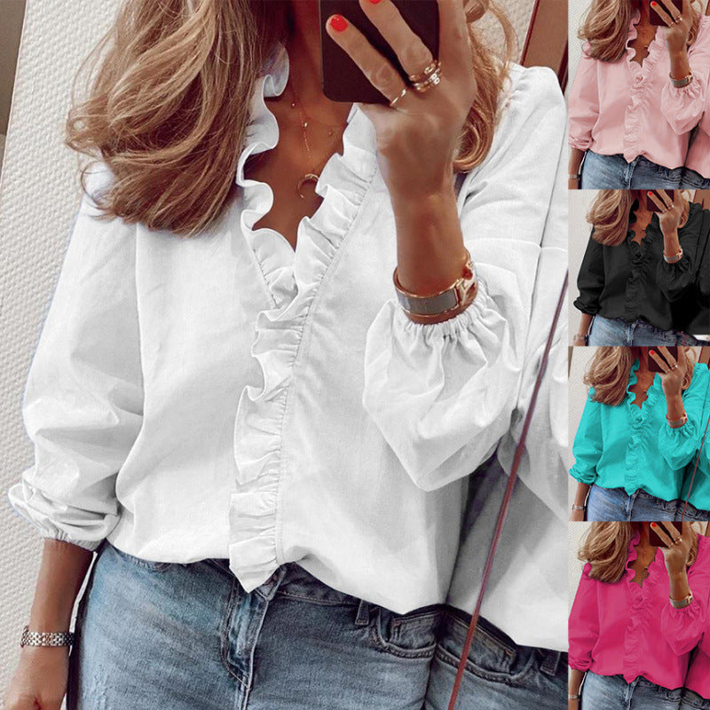Damblus med volangdetaljer och elegant ståkrage Mirla-Eva Jonsson