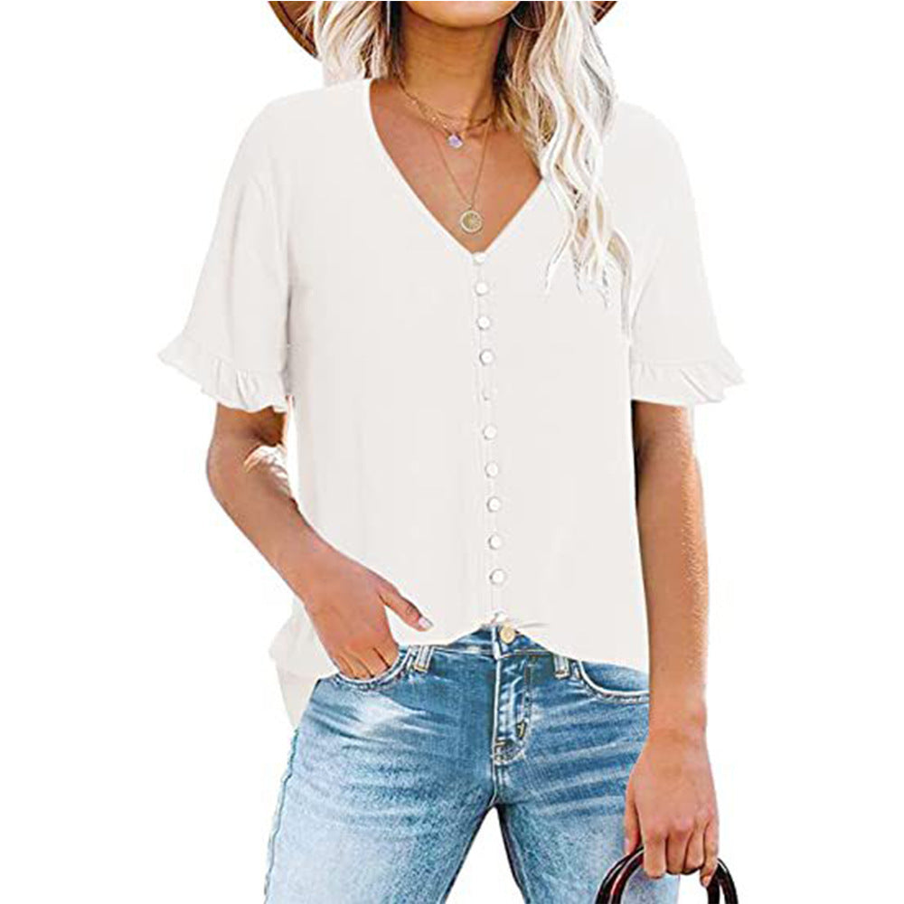 Damblus med volangdetaljer och knappslå Mirla-Eva Jonsson