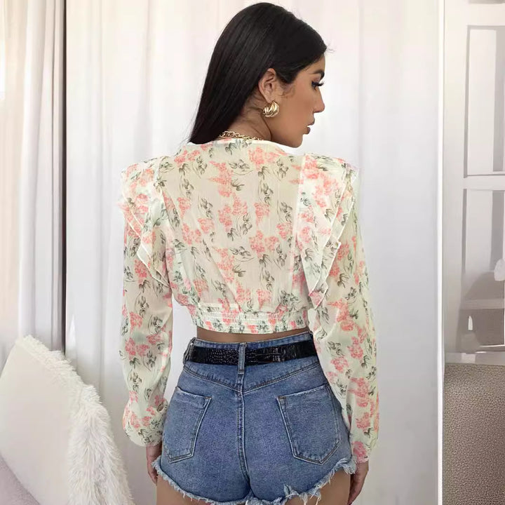 Damblus med volanger och blommig design Mirla-Eva Jonsson