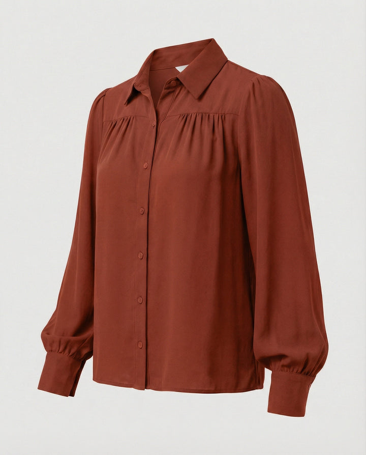 Damblus med voluminösa ärmar och eleganta volangdetaljer-Eva Jonsson