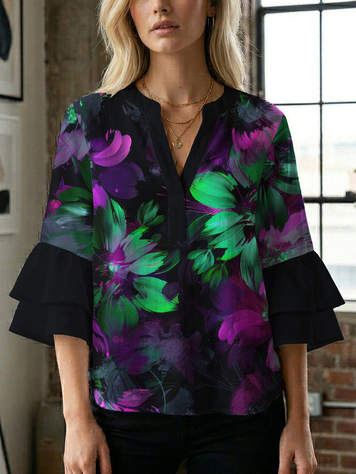 Damblus med voluminösa prickiga ärmar och blommönster Mirla-Eva Jonsson