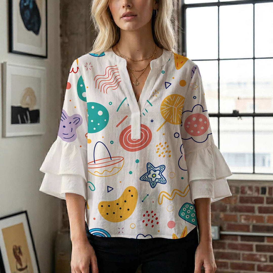 Damblus med voluminösa prickiga ärmar och blommönster Mirla-Eva Jonsson