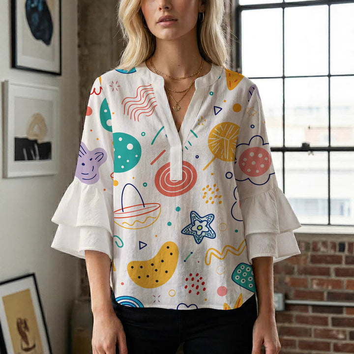 Damblus med voluminösa prickiga ärmar och blommönster Mirla-Eva Jonsson