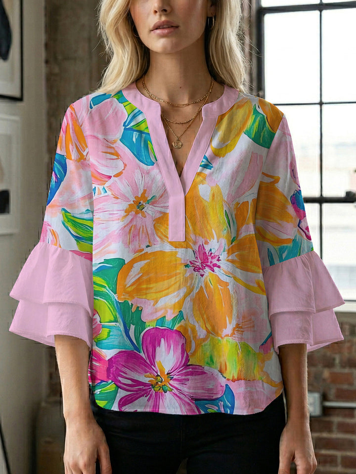 Damblus med voluminösa prickiga ärmar och blommönster Mirla-Eva Jonsson