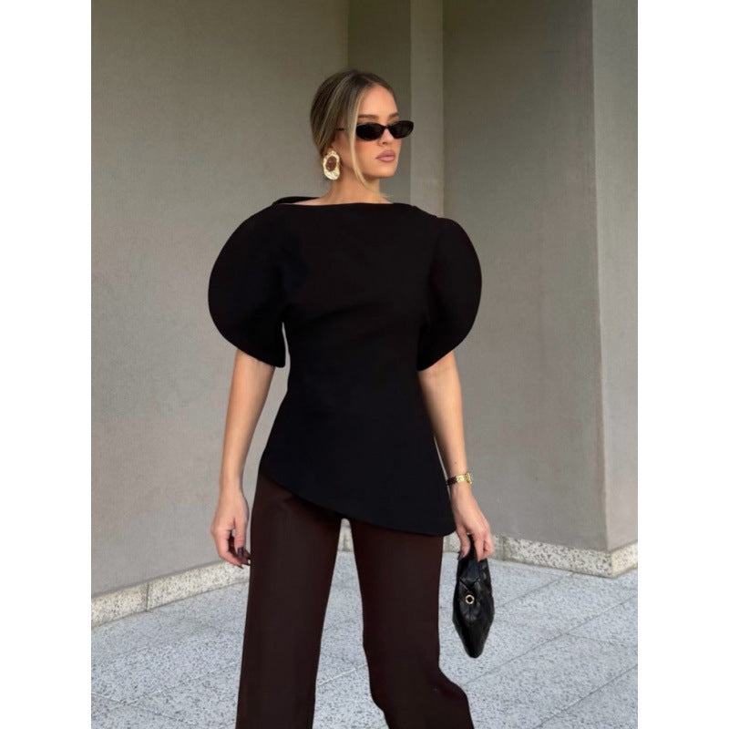 Damblus med voluminösa puffärmar och asymmetrisk nederkant Mirla-Eva Jonsson