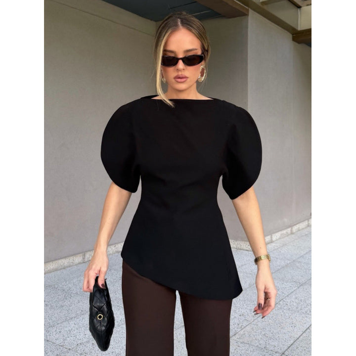 Damblus med voluminösa puffärmar och asymmetrisk nederkant Mirla-Eva Jonsson