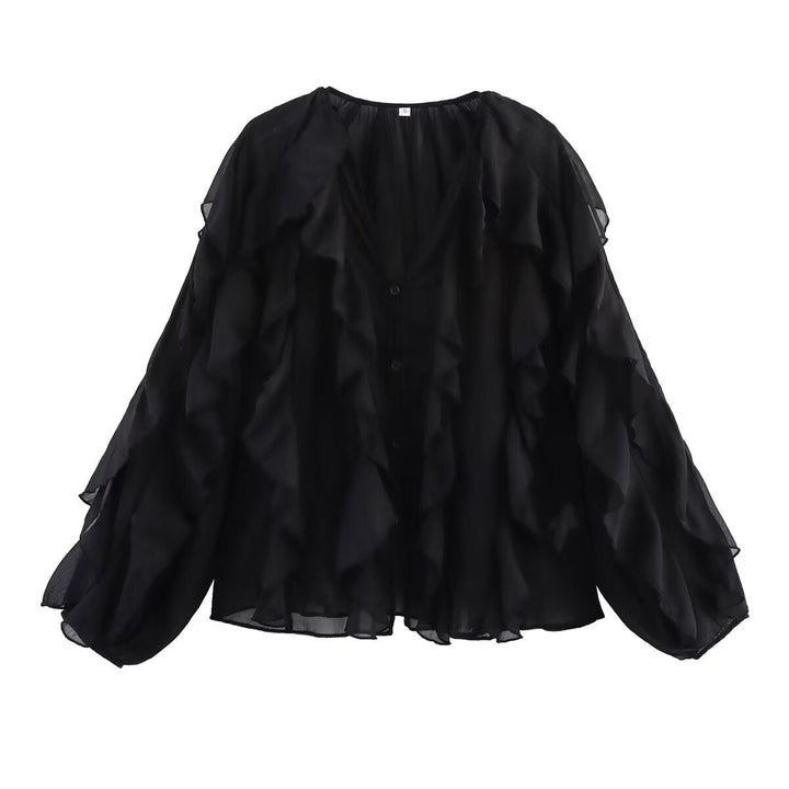 Damblus med voluminösa ruffledetaljer och elegant snitt Mirla-Eva Jonsson