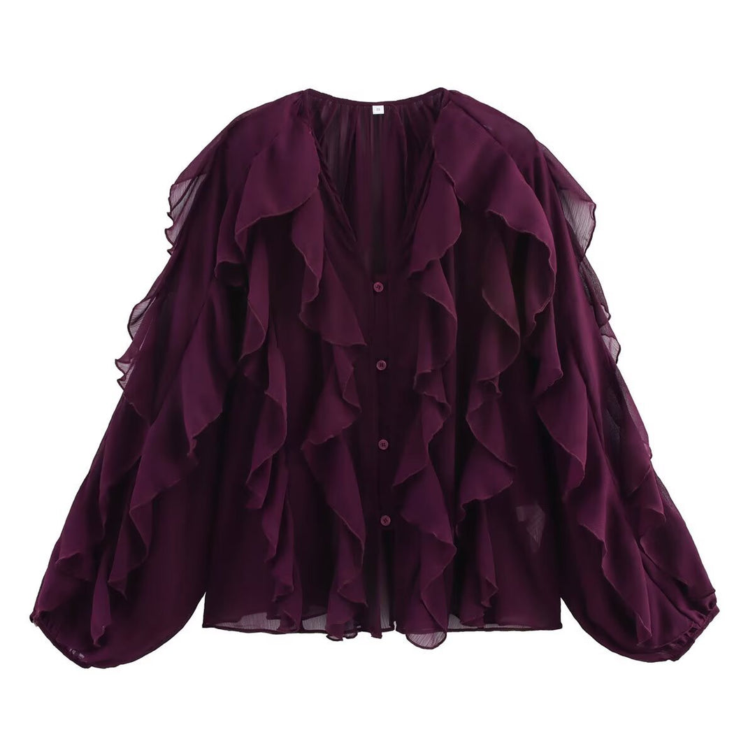 Damblus med voluminösa ruffledetaljer och elegant snitt Mirla-Eva Jonsson