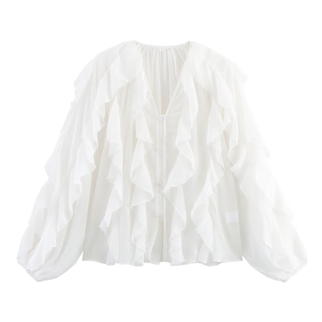 Damblus med voluminösa ruffledetaljer och elegant snitt Mirla-Eva Jonsson