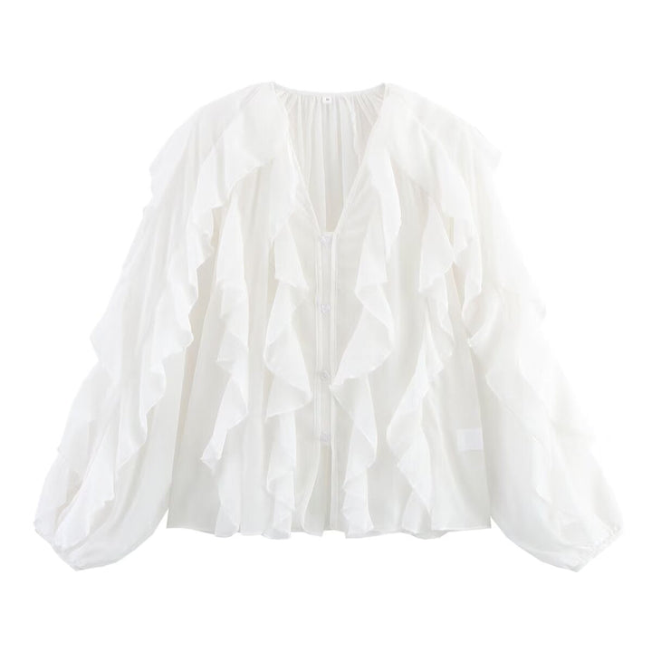 Damblus med voluminösa ruffledetaljer och elegant snitt Mirla-Eva Jonsson