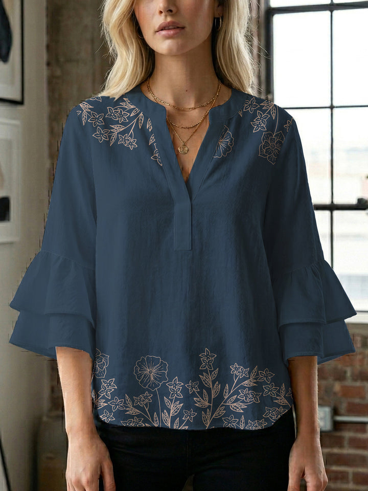 Damblus med voluminösa ryschkarmar och blommigt tryck Mirla-Eva Jonsson