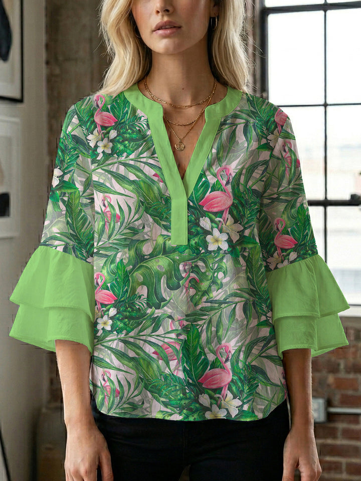 Damblus med voluminösa ryschkarmar och blommigt tryck Mirla-Eva Jonsson