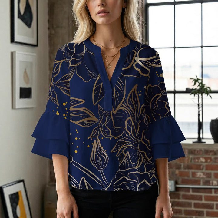 Damblus med voluminösa ryschkarmar och blommigt tryck Mirla-Eva Jonsson