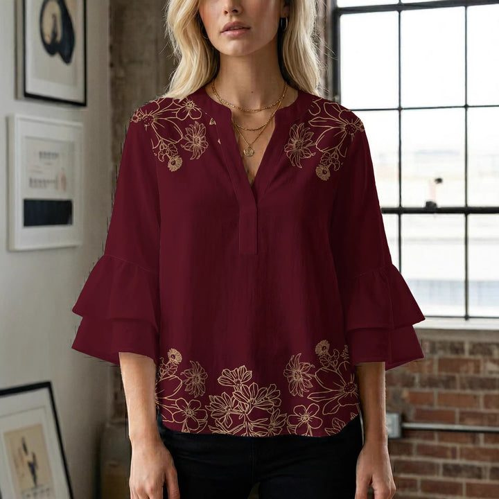 Damblus med voluminösa ryschkarmar och blommigt tryck Mirla-Eva Jonsson