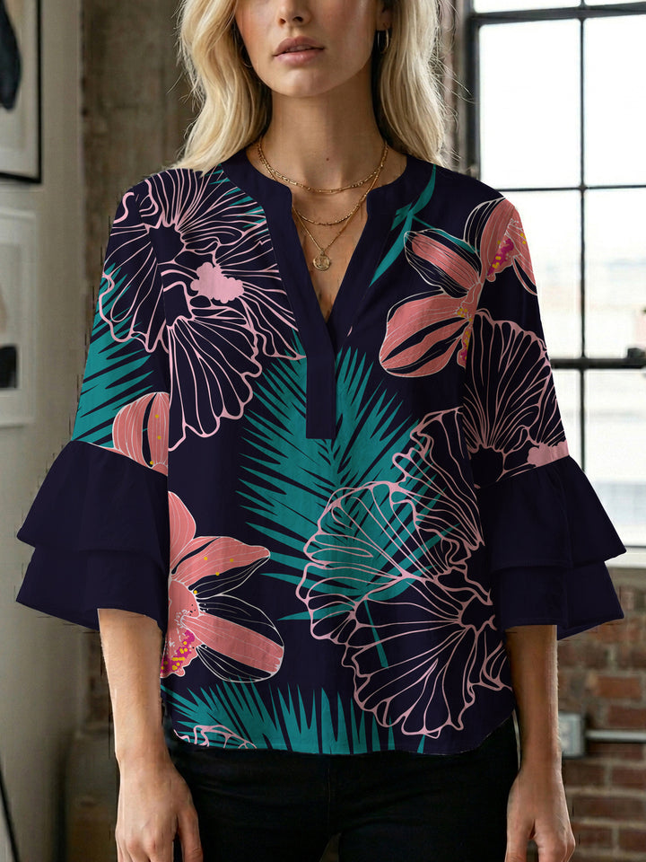Damblus med voluminösa ryschkarmar och blommigt tryck Mirla-Eva Jonsson