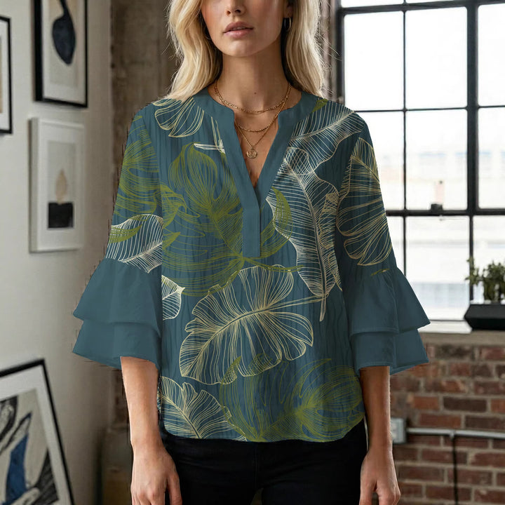 Damblus med voluminösa ryschkarmar och blommigt tryck Mirla-Eva Jonsson