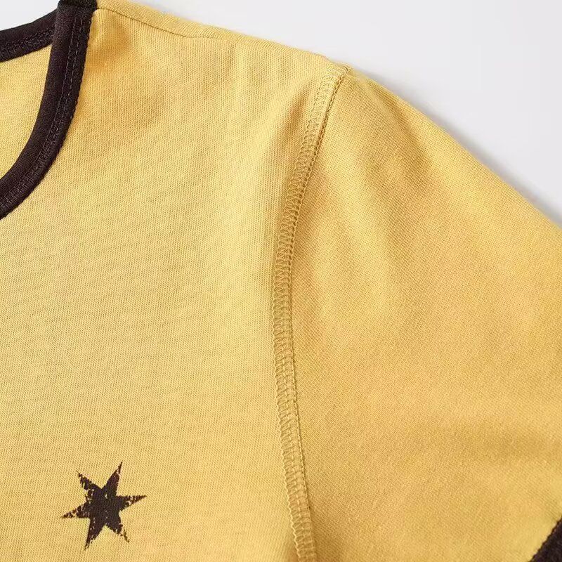 Damd Vintage T-shirt med rund halsringning och iögonfallande grafisk tryck Mirla-Eva Jonsson