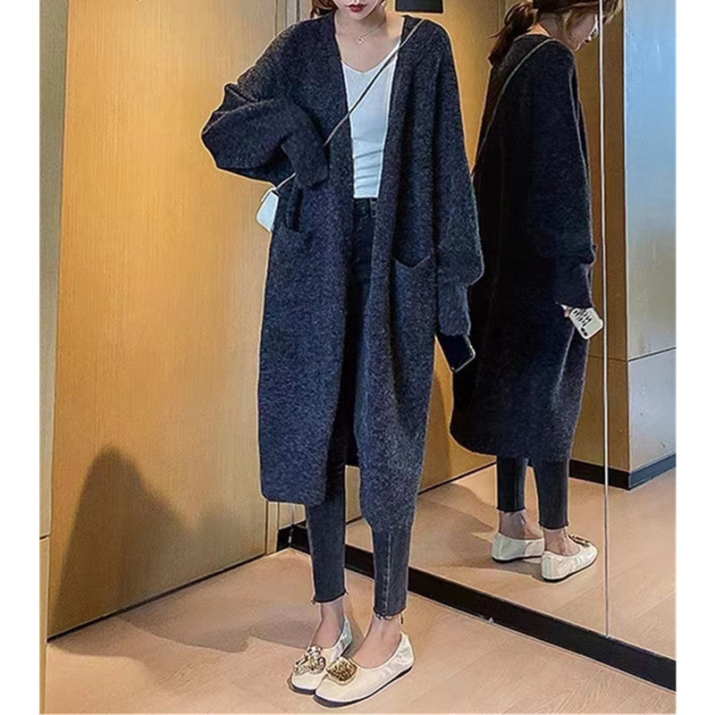 Damd oversized stickad kappa med fickor och avslappnad passform Mirla-Eva Jonsson