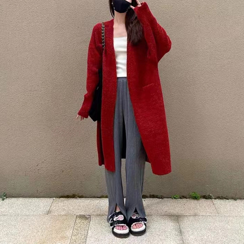 Damd oversized stickad kappa med fickor och avslappnad passform Mirla-Eva Jonsson