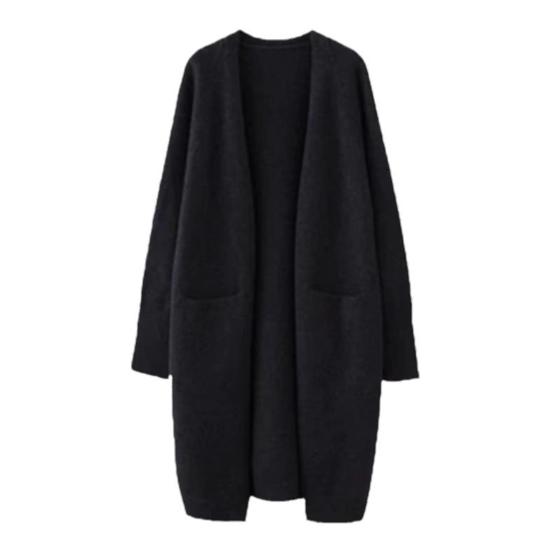 Damd oversized stickad kappa med fickor och avslappnad passform Mirla-Eva Jonsson