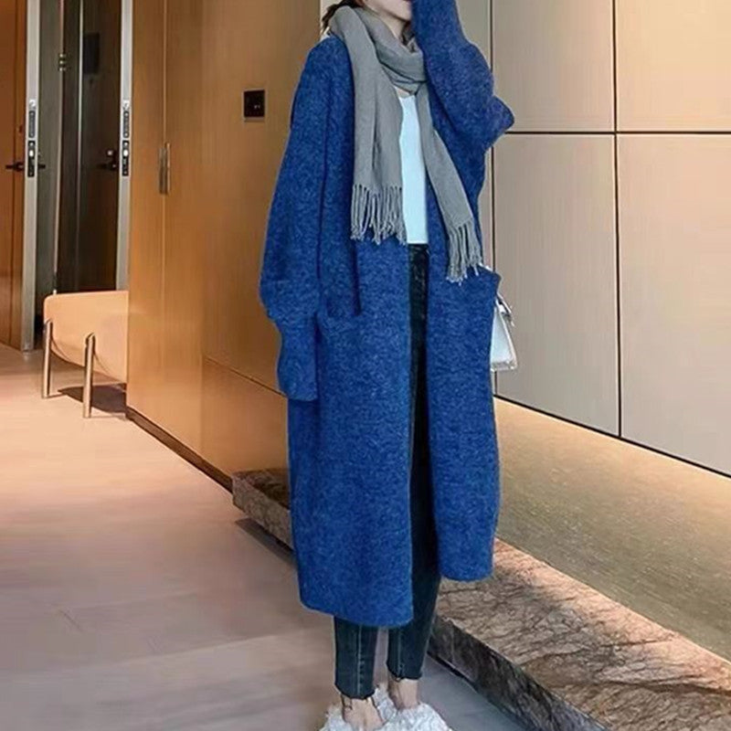 Damd oversized stickad kappa med fickor och avslappnad passform Mirla-Eva Jonsson