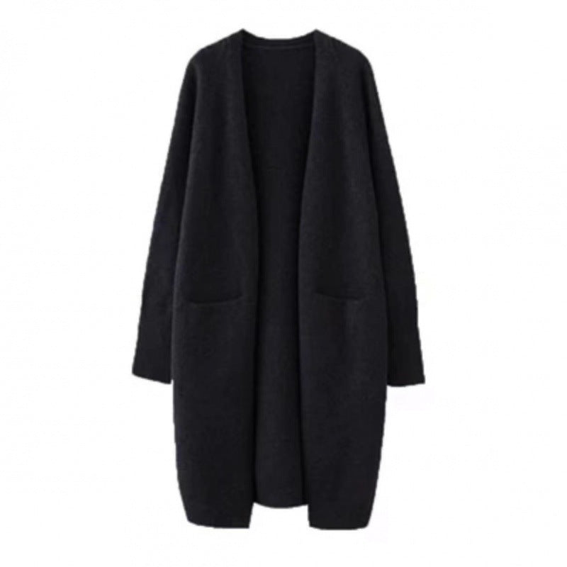 Damd oversized stickad kappa med fickor och avslappnad passform Mirla-Eva Jonsson