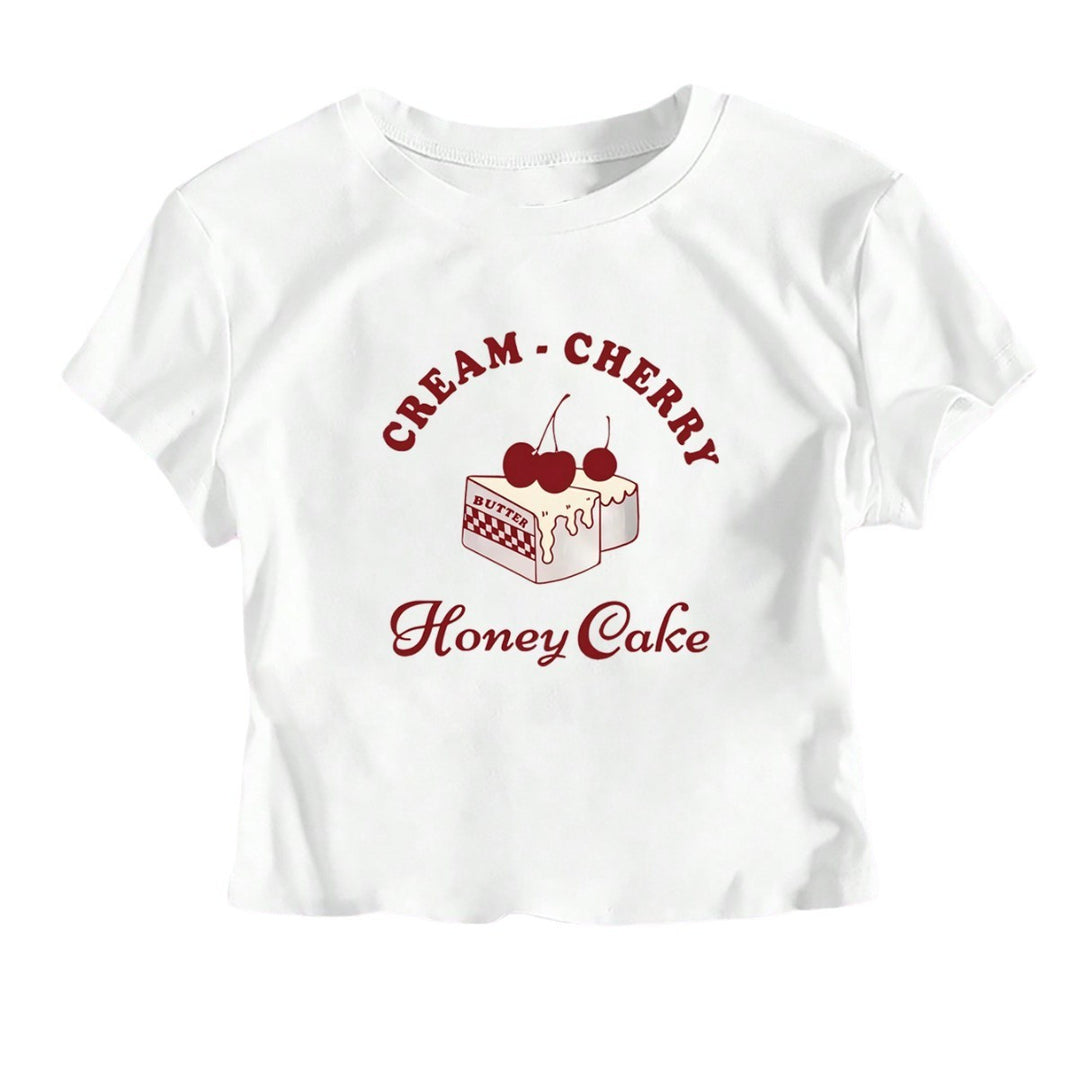 Dame Crop-T-Shirt med kreativ dessertmotiv och modern skärning Mirla-Eva Jonsson